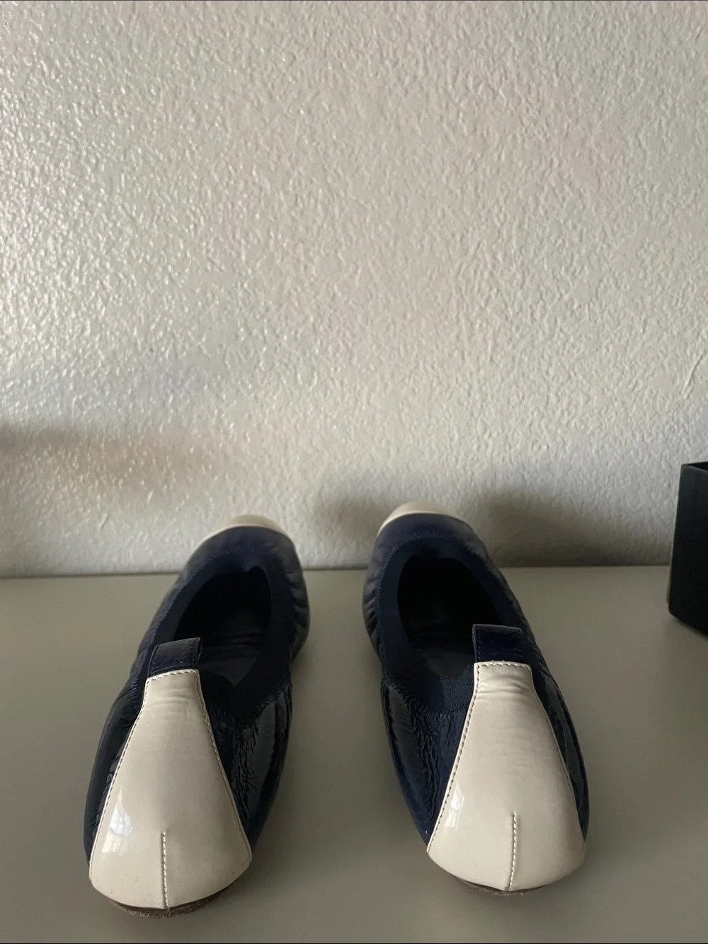 CHANEL Navy and Ivory Quilted Cap-Toe Ballet Flats